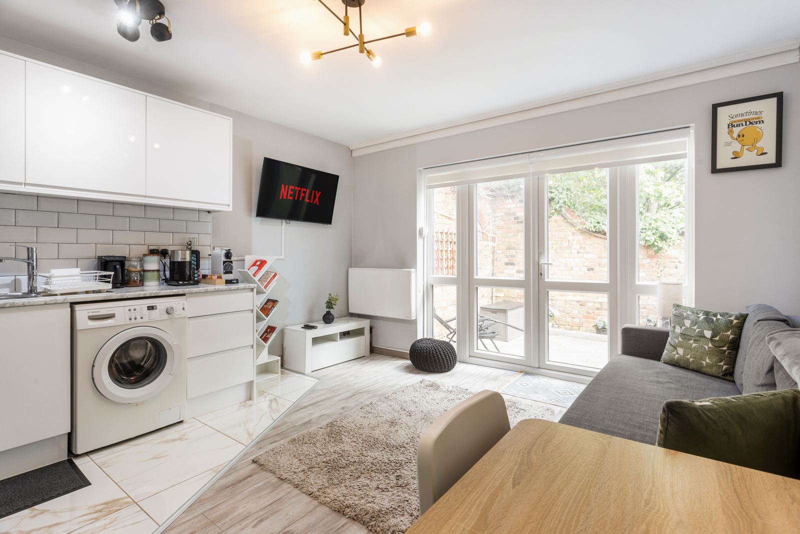 Open-plan kitchen and living room with garden view