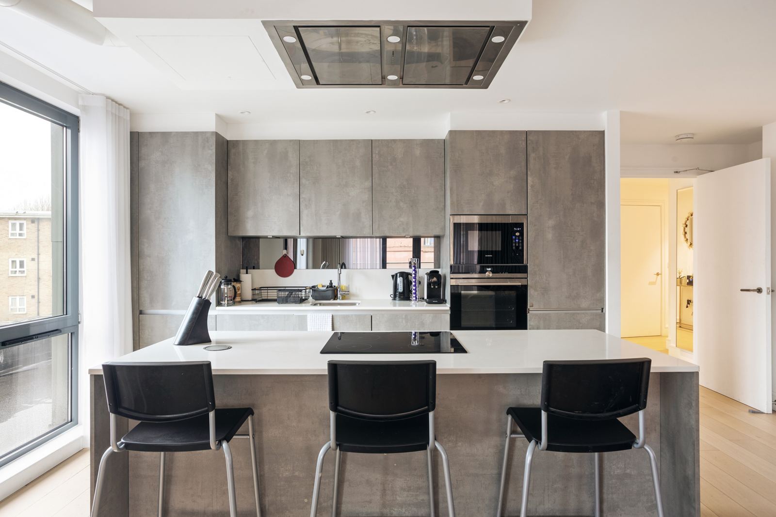 Kitchen island with three bar stools