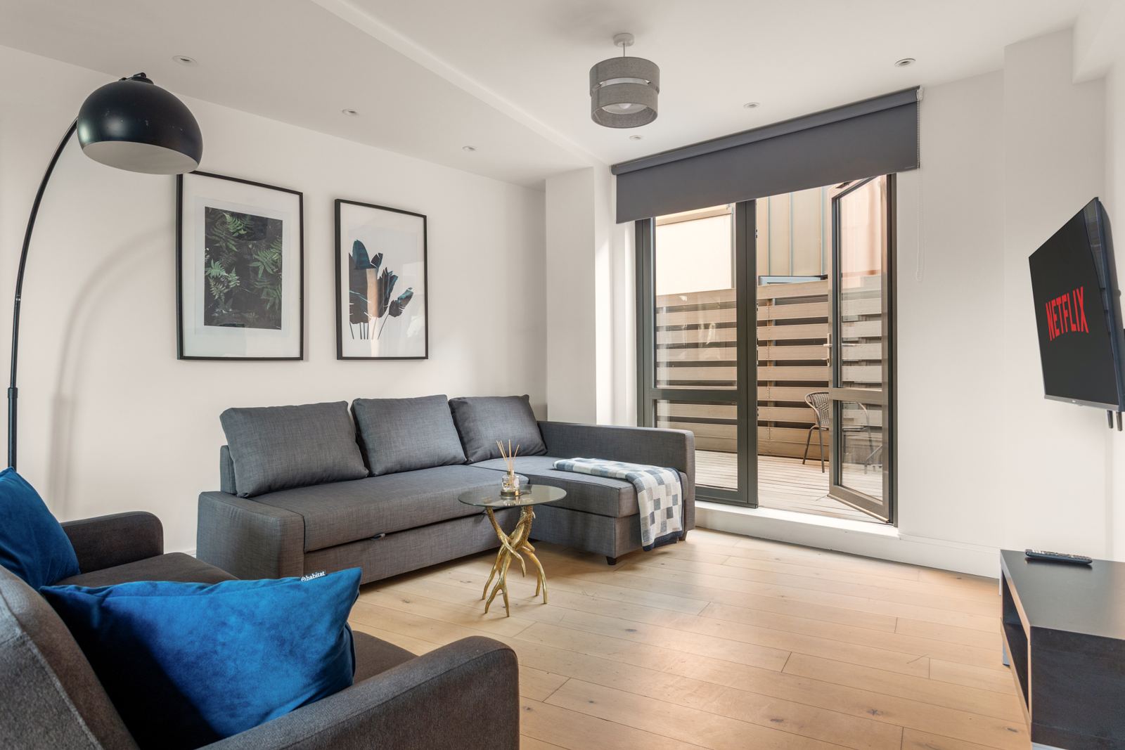 Living room with corner sofa and terrace doors