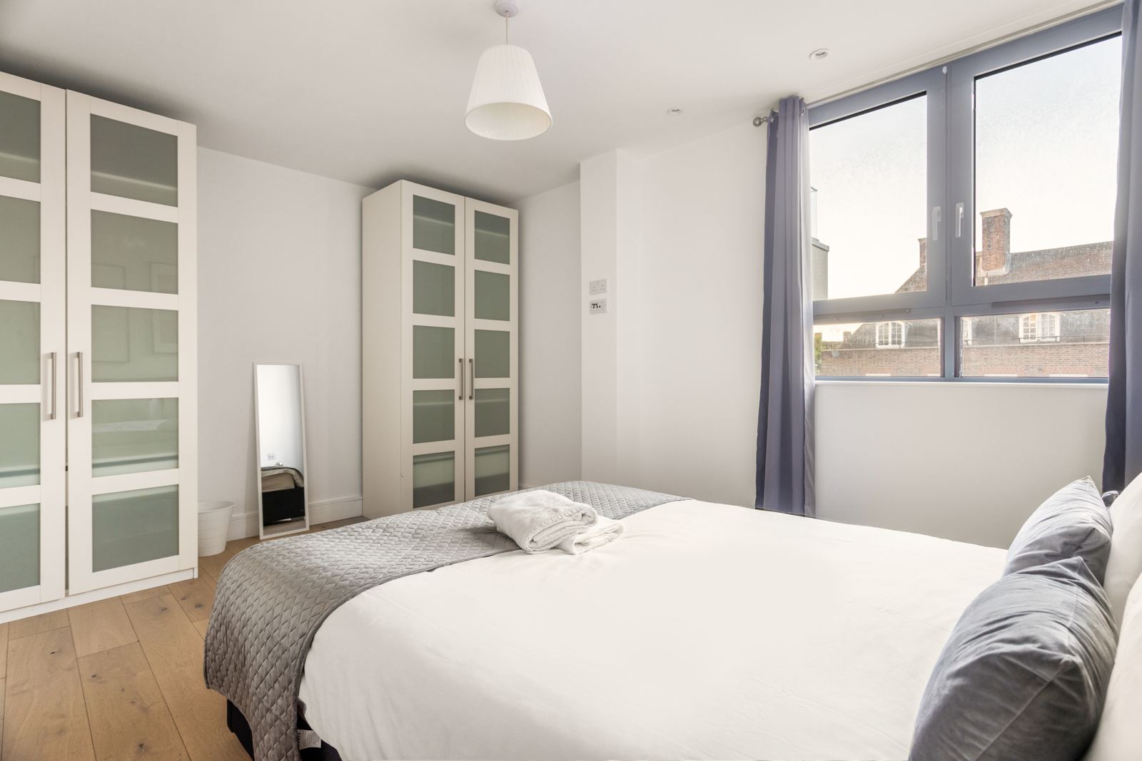 Bedroom with wardrobes and window